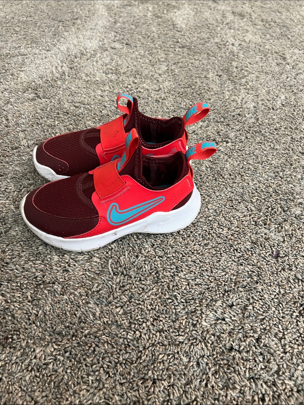 Nike Kids Red and Burgundy Slip-On Sneakers with Blue Swoosh